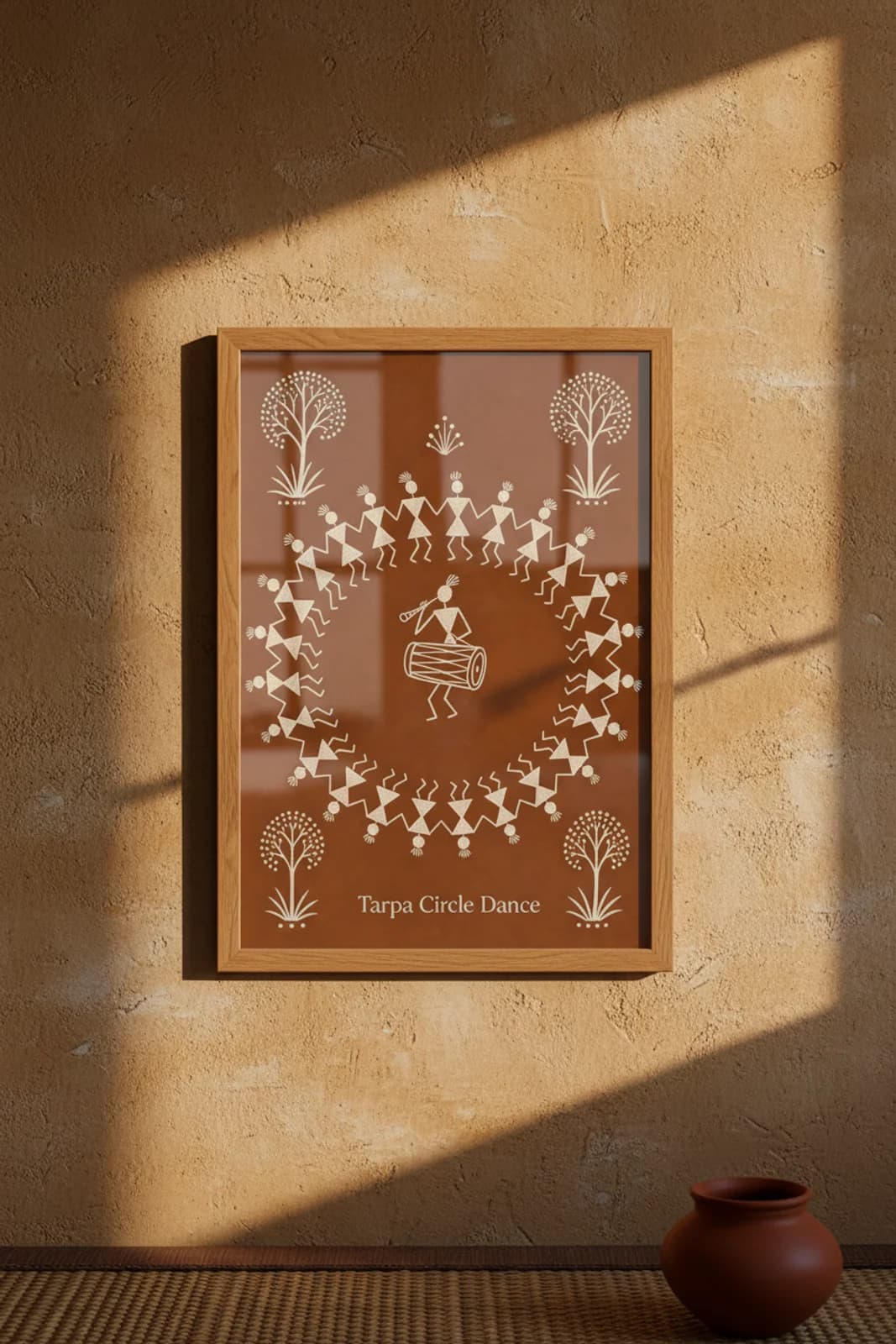 Tarpa Circle Dance Warli print in natural oak A2 frame on warm-earth-neutral mud-plaster wall — rustic Indian folk art mockup