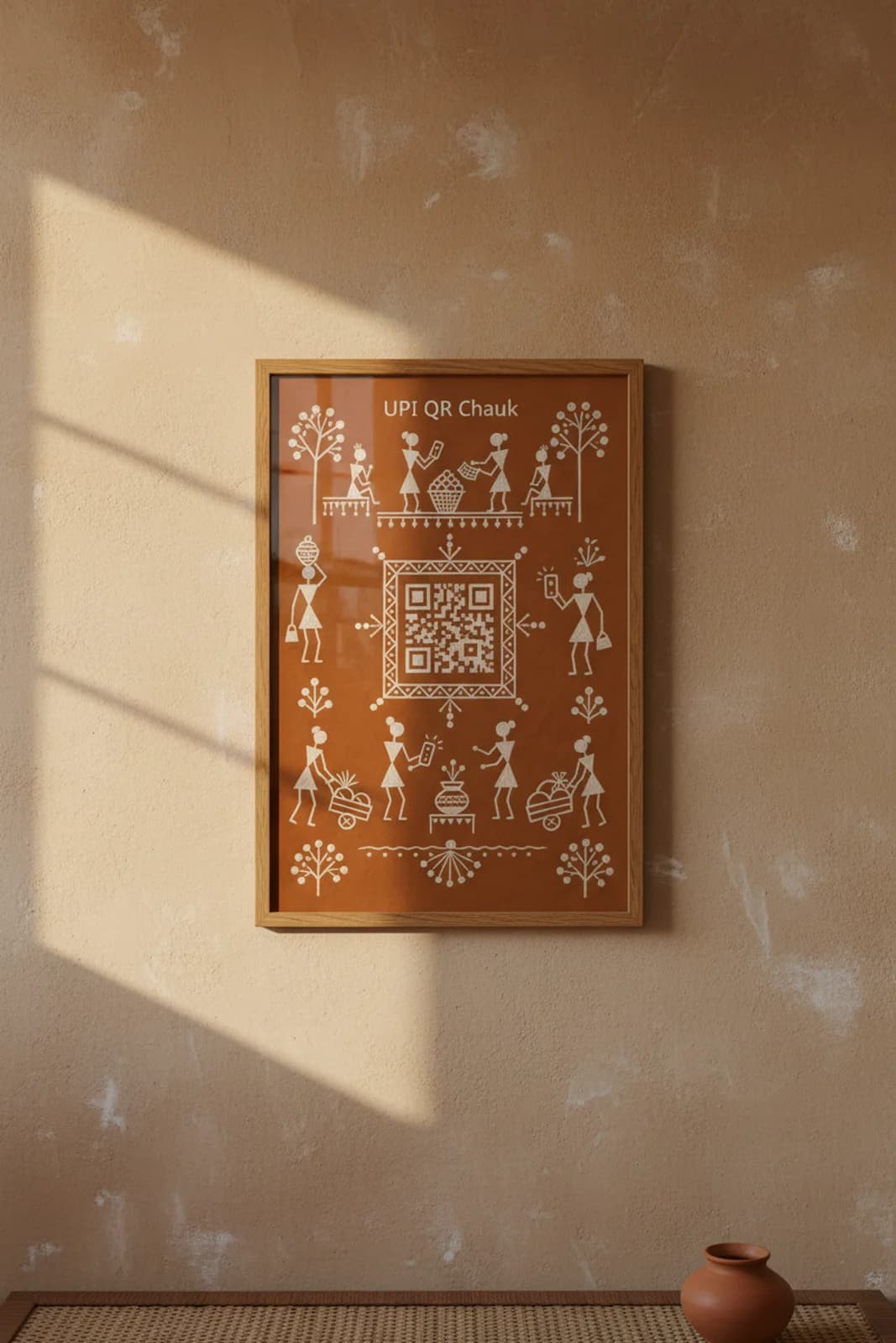 UPI QR Chauk Warli print in natural oak A2 frame on warm-earth-neutral mud-plaster wall — rustic Indian folk art mockup