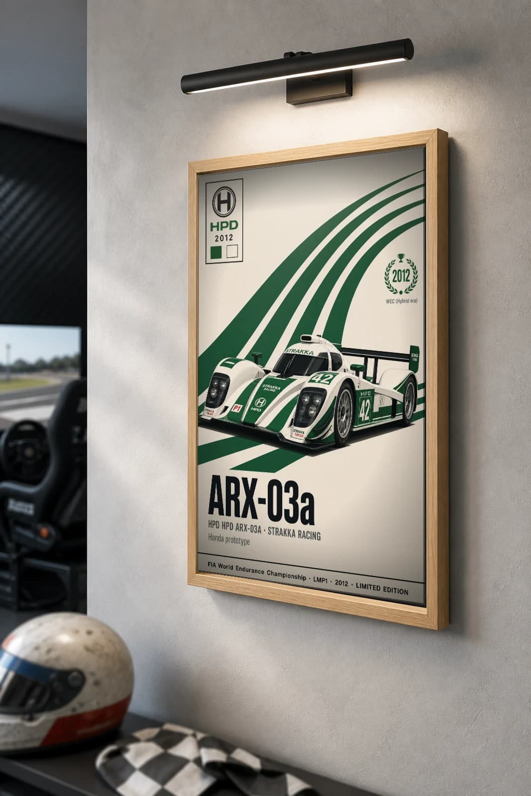 Strakka Racing ARX-03a Poster — 2012 LMP1 WEC racing wall art · #42 · framed A2 — the framed print shown at a three-quarter angle on a styled gallery wall in a natural-oak frame