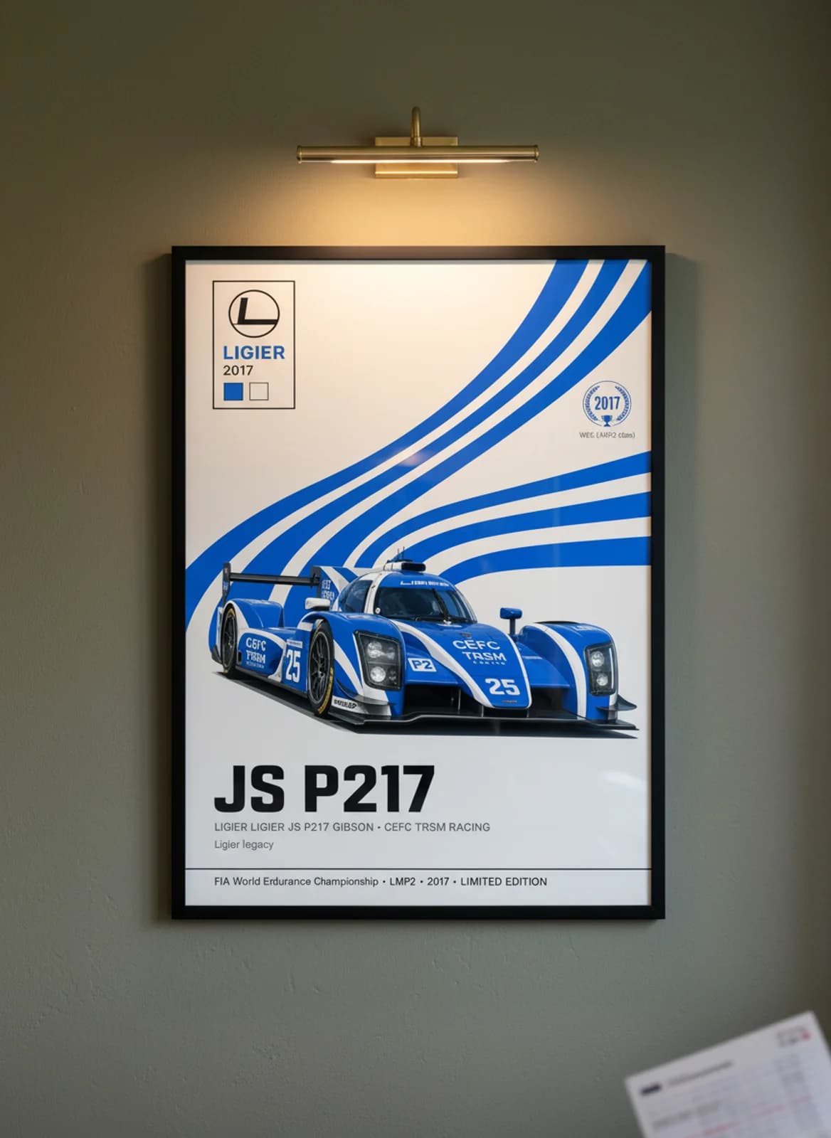 JS P217 — CEFC TRSM #25 WEC Masters endurance print in black A2 frame on royal-blue olive wall — WEC Masters mockup